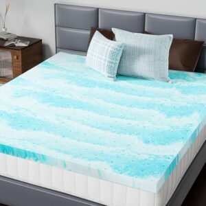 DUMOS memory foam mattress topper in aqua blue gel-infused foam with ventilation holes on bed with grey headboard and pillows