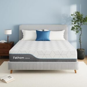 White FATHOM memory foam mattress medium firm with geometric pattern on light gray upholstered platform bed in modern bedroom