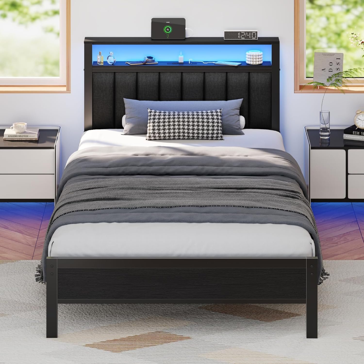 Black Furnulem platform bed frame with LED-lit upholstered headboard, storage shelf, grey bedding in modern bedroom with blue underglow