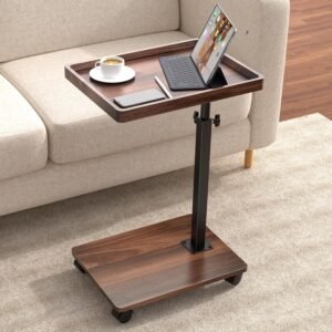 Walnut rolling adjustable C-table end table with height-adjustable pole, 360° swivel top, coffee cup, tablet, laptop, and beige sofa