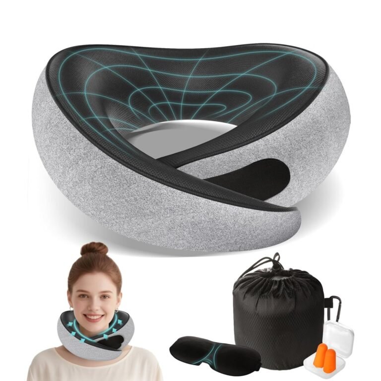 Gray ergonomic travel neck pillow with contoured memory foam design, shown with black carrying pouch, sleep mask, and earplugs