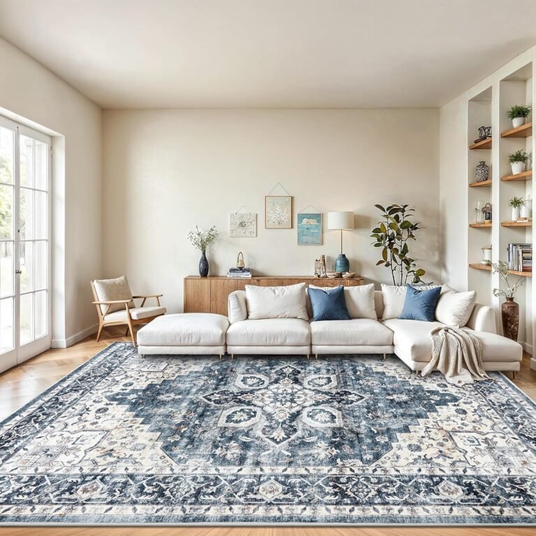 Large navy blue and cream vintage Persian washable area rug in modern living room with white sectional sofa