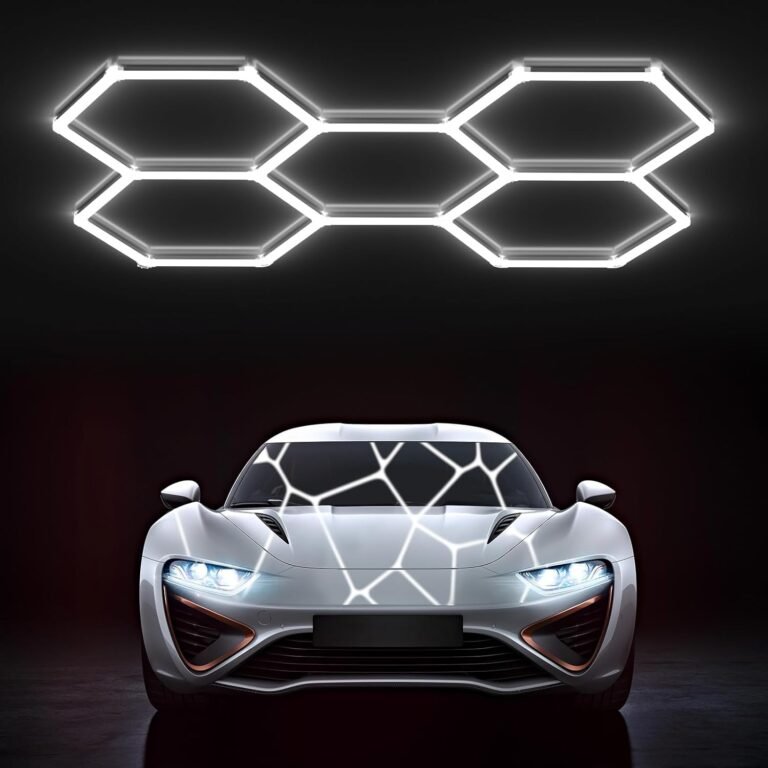 Product Reviews 3 Six white Hexagon LED Light Gen 2 panels linked in honeycomb pattern glowing bright white above silver sports car in dark garage