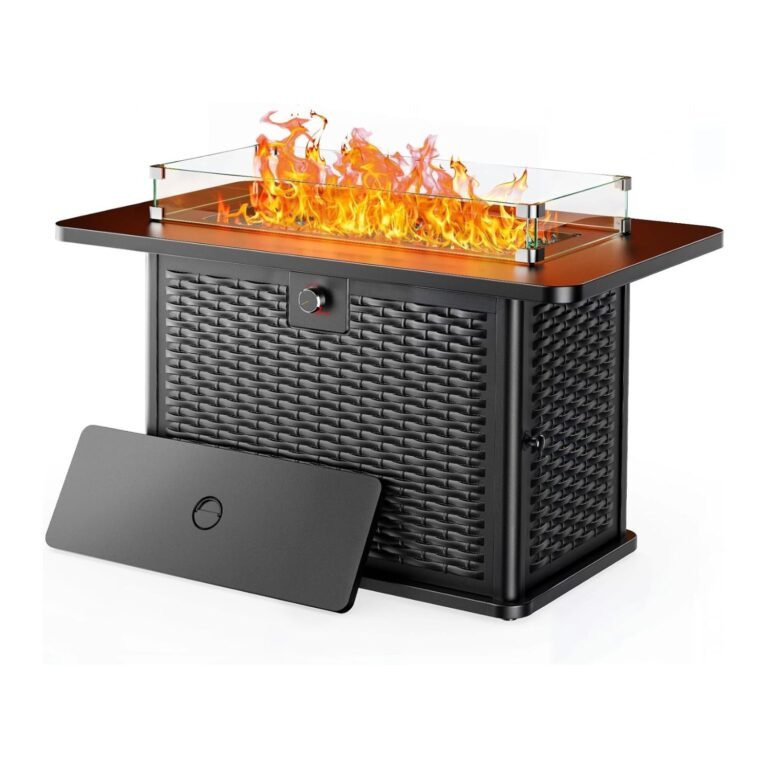 Ciays propane fire pit table rectangular with dancing flames behind glass guards, bronze top, black wicker base, and protective cover