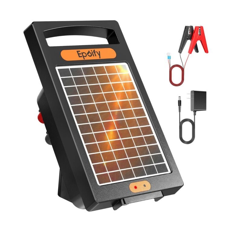 Solar electric fence charger in black with orange solar panel, battery clamps with LED indicator, and AC adapter
