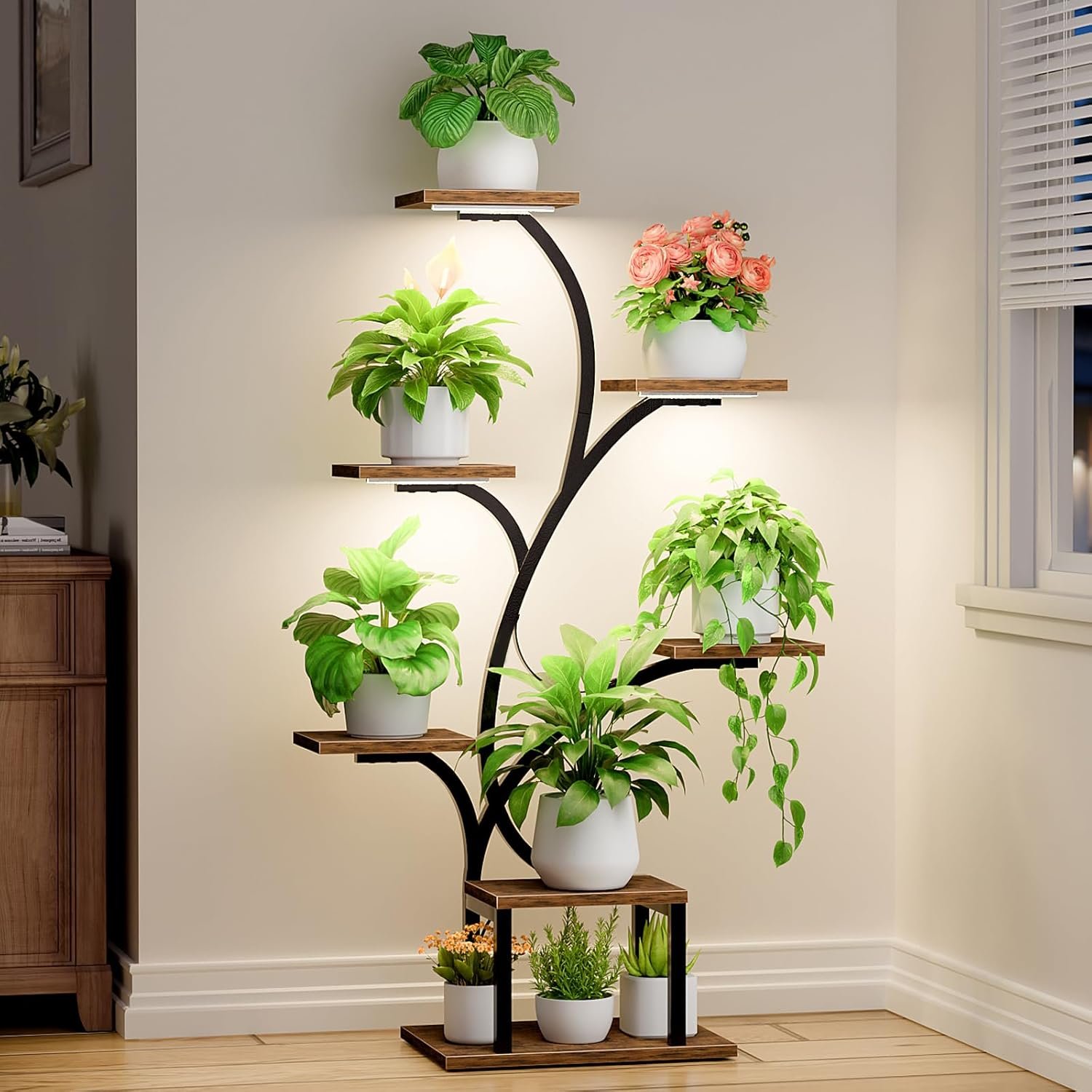 BACEKOLL 7-Tier Indoor Plant Stand with LED grow lights displaying green plants and pink flowers in white pots on wooden shelves